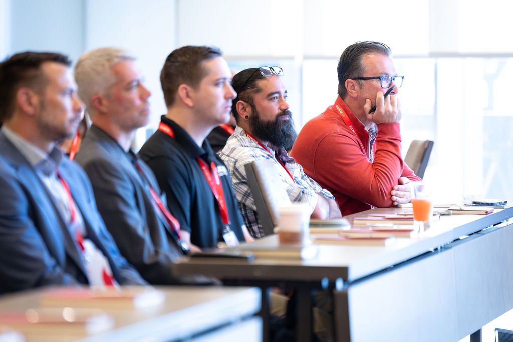 Attendees listening during an IGNITE 25 conference session