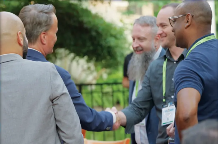People saying hi to each other at a social event.