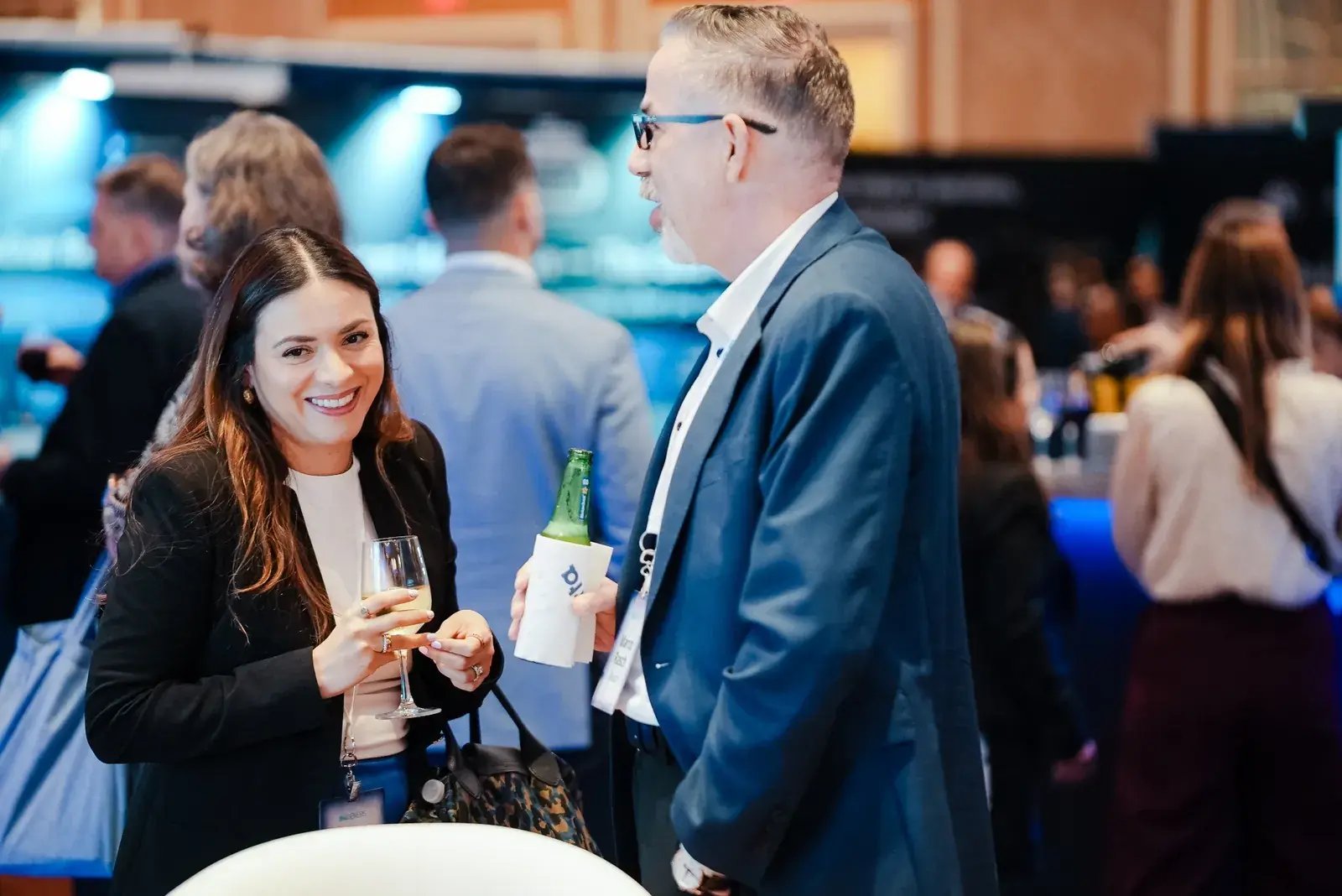 Attendees networking during a supply chain and logistics industry event at the American Supply Chain Summit.