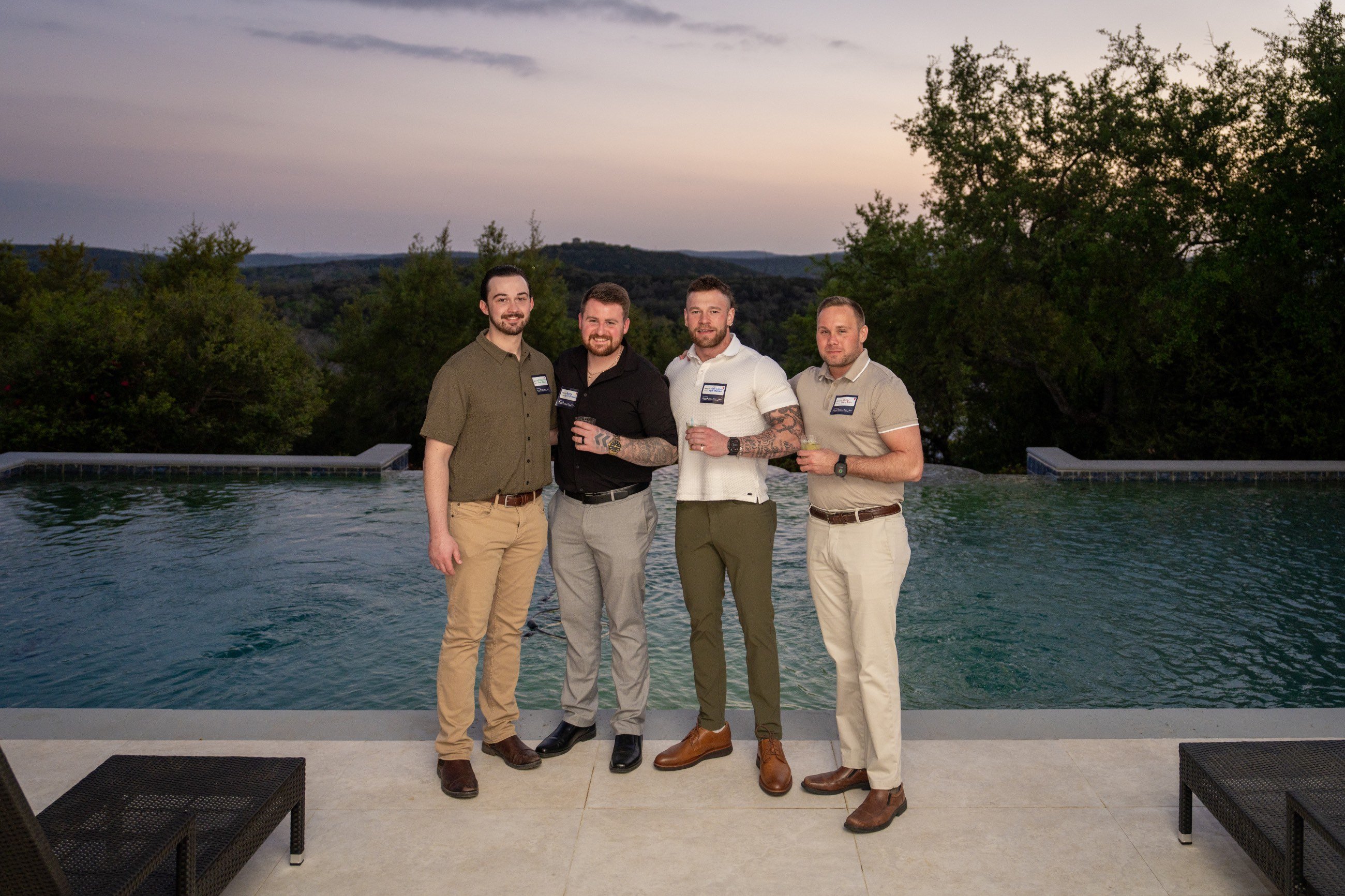 Guests posing by the pool