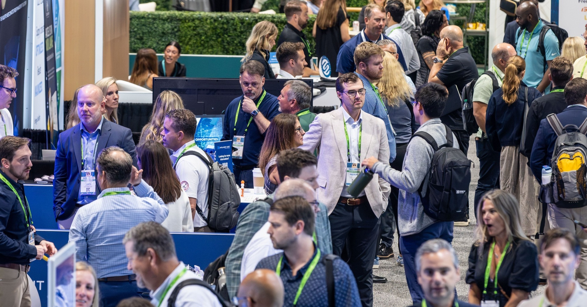 PARCEL Forum ’26 attendees network during an expo-hall reception in Orlando.