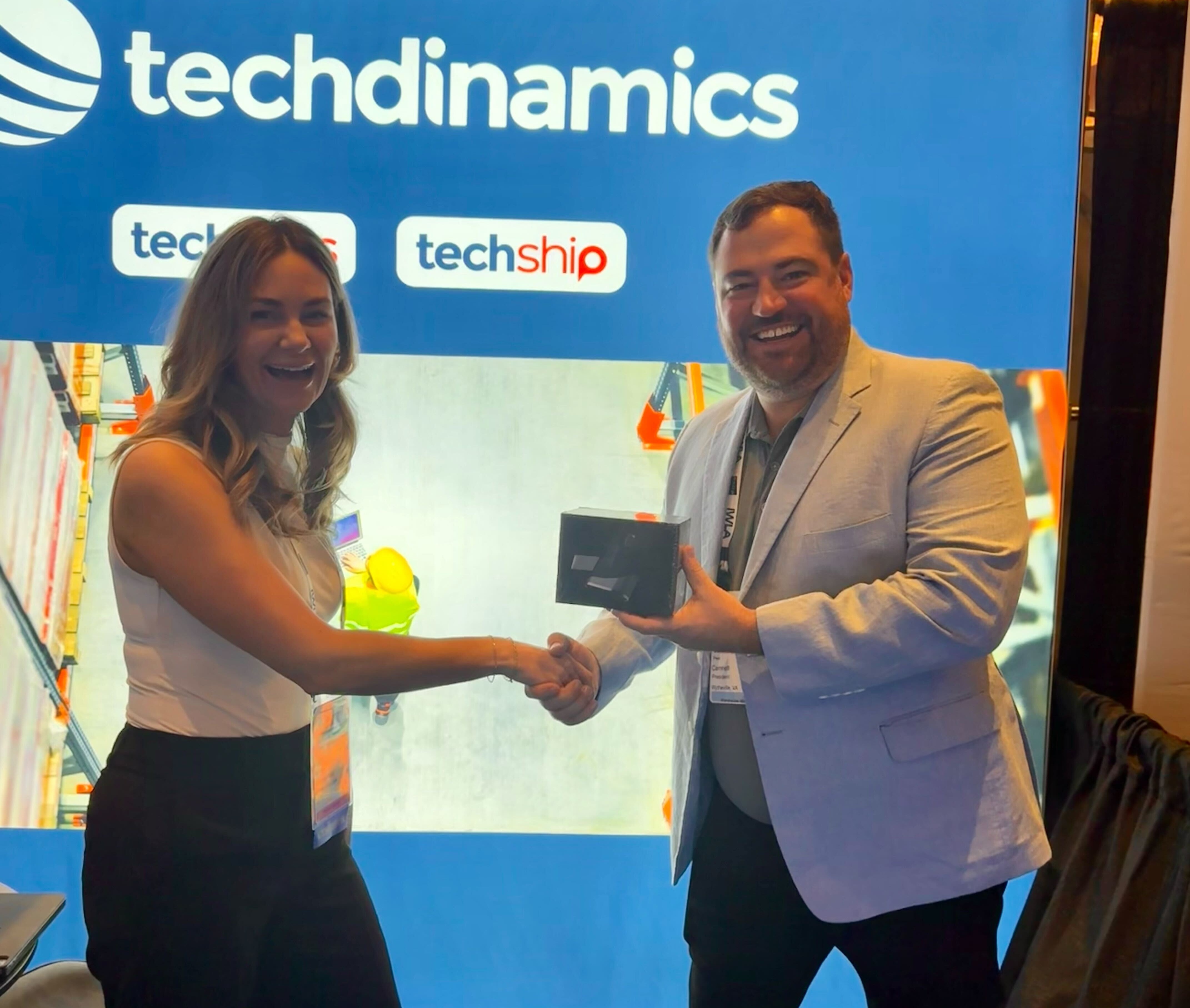 Cameron Peel receiving the giveaway prize