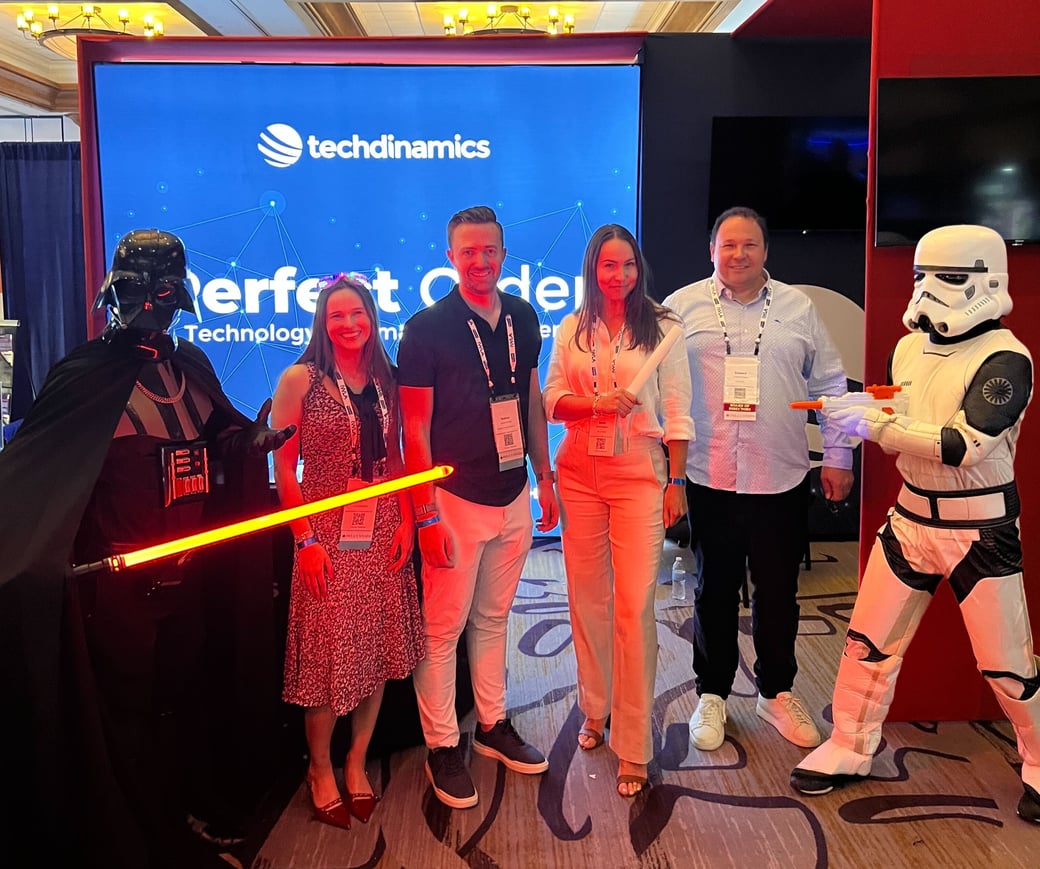 Members of the Techdinamics Team (Clare, Nathan, Maria and Edward) with Star Wars characters.
