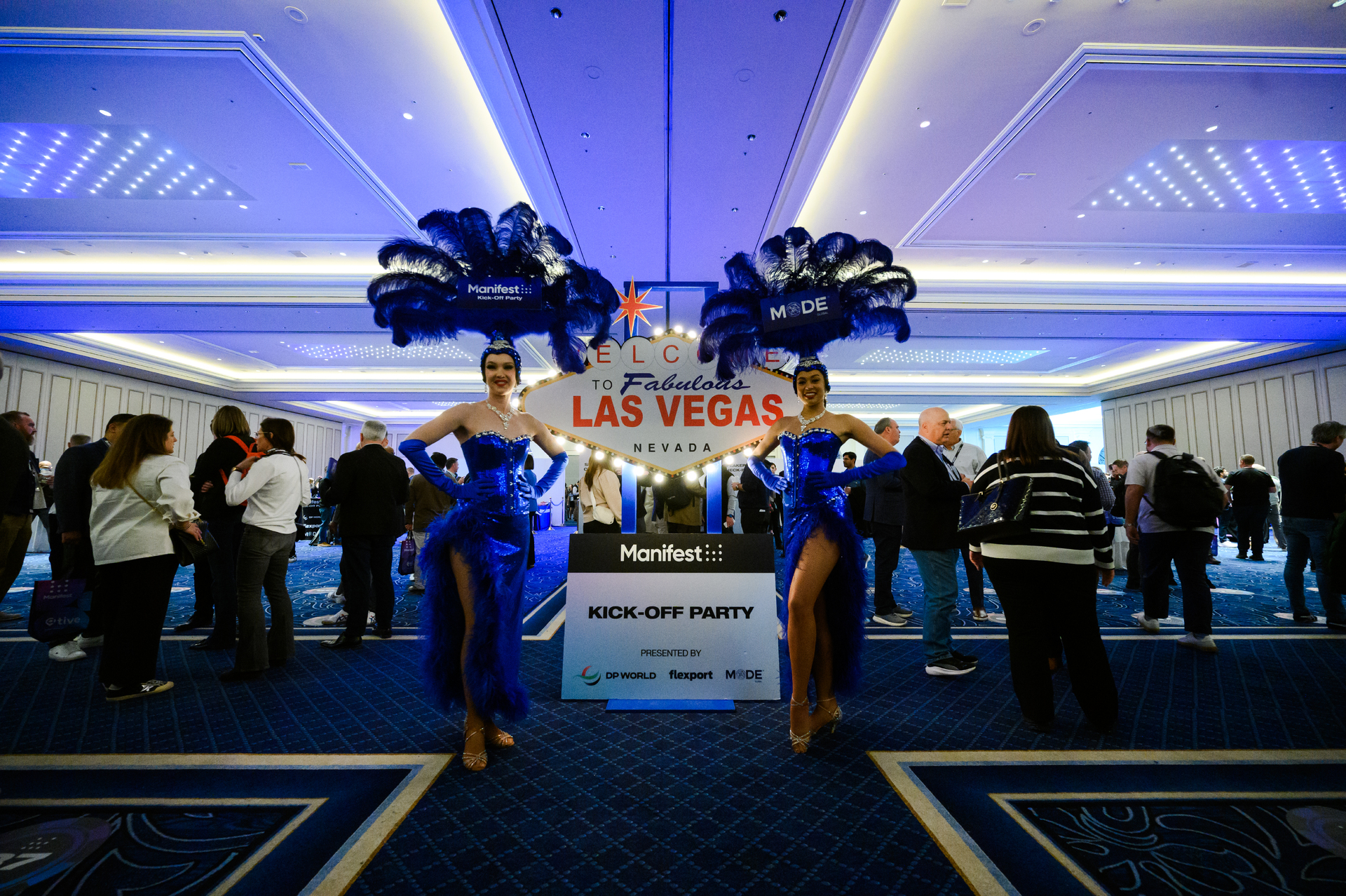 Two dancers dressed in blue