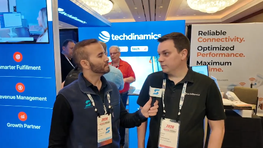 Scott being interviewed by a podcaster at the booth