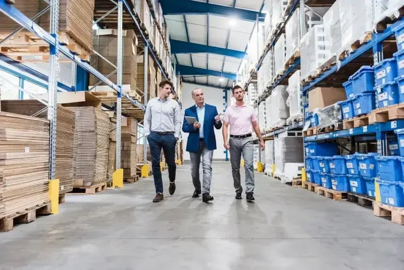 compressed_business-people-meeting-in-company-storehouse