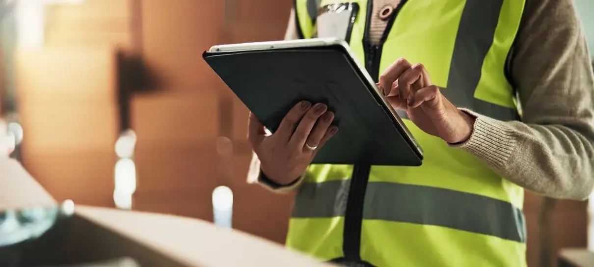 supply-chain-warehouse-and-hands-of-person-on-tab